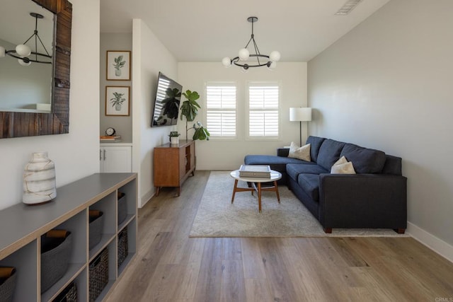 744 Adelaide Cir, Encinitas, CA 92024 - living area featuring a chandelier and wood finished floors