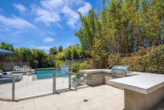 744 Adelaide Cir, Encinitas, CA 92024 - view of swimming pool featuring an outdoor kitchen, a patio, and a fenced backyard