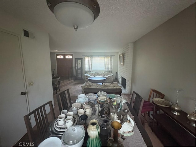 197 Limestone Rd, Claremont, CA 91711 - dining room with carpet flooring and a textured ceiling