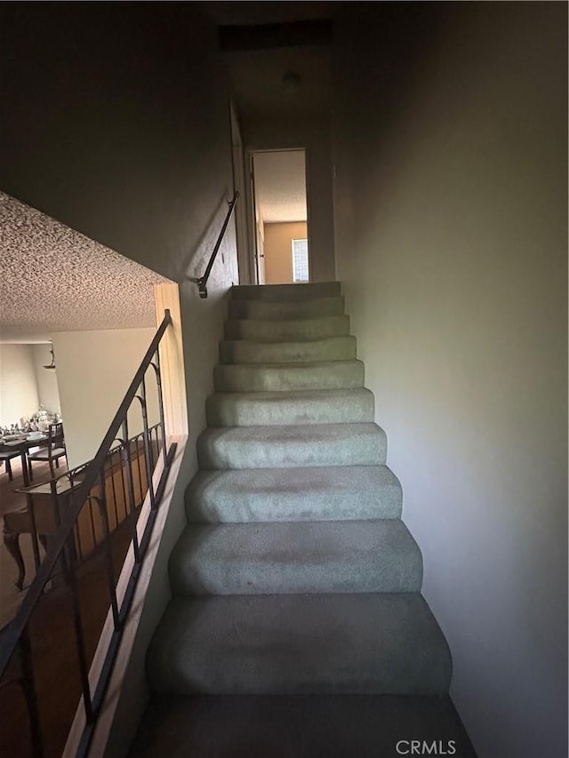 197 Limestone Rd, Claremont, CA 91711 - stairs with a textured ceiling
