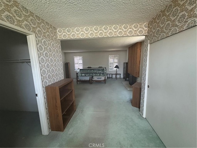 197 Limestone Rd, Claremont, CA 91711 - corridor featuring wallpapered walls, a textured ceiling, and carpet flooring