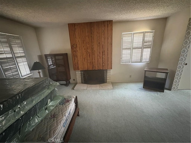 197 Limestone Rd, Claremont, CA 91711 - carpeted bedroom with a textured ceiling and a fireplace