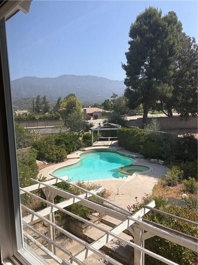 197 Limestone Rd, Claremont, CA 91711 - view of pool featuring a mountain view, a patio area, and a pool with connected hot tub
