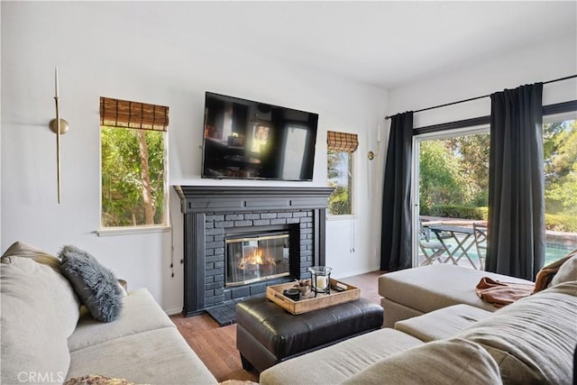 8042 Masefield Ct, West Hills, CA 91304 - living room featuring wood finished floors and a fireplace