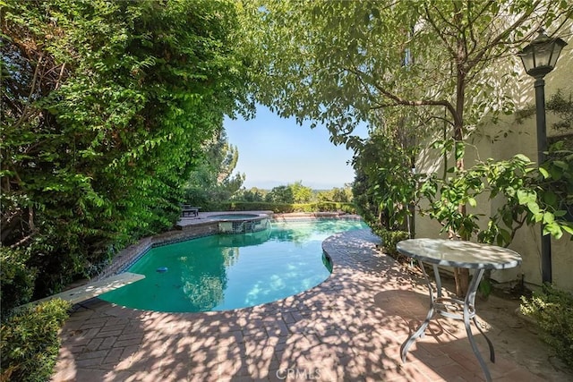 8042 Masefield Ct, West Hills, CA 91304 - view of swimming pool featuring a patio area, a diving board, and a pool with connected hot tub