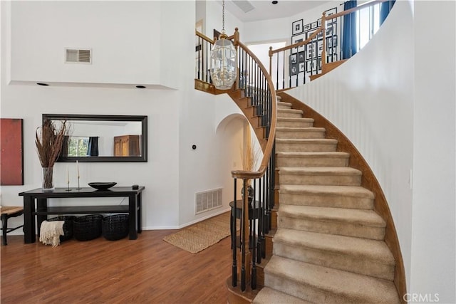 8042 Masefield Ct, West Hills, CA 91304 - stairs featuring wood finished floors and a towering ceiling