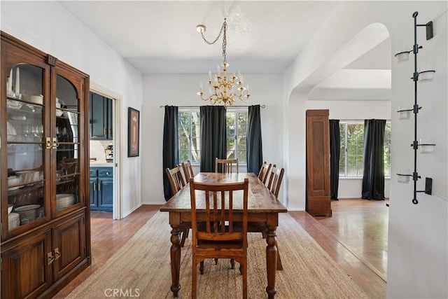 8042 Masefield Ct, West Hills, CA 91304 - dining space featuring light wood-type flooring, plenty of natural light, and a chandelier