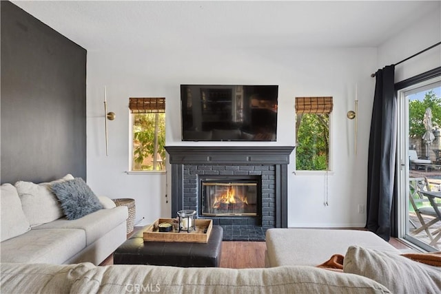 8042 Masefield Ct, West Hills, CA 91304 - living room featuring wood finished floors and a brick fireplace