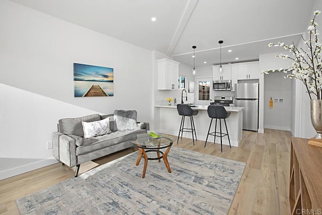 1254 13th St, Imperial Beach, CA 91932 - living area featuring light wood-style flooring, recessed lighting, and vaulted ceiling