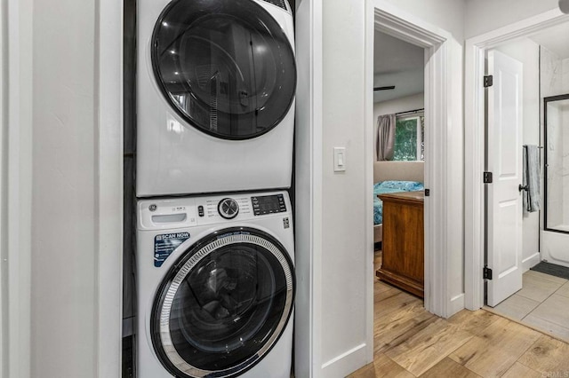 1254 13th St, Imperial Beach, CA 91932 - laundry room featuring estacked washer and dryer and light wood-style flooring