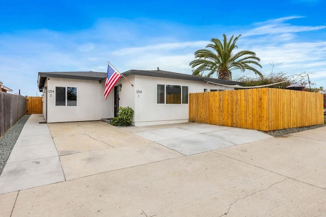 1254 13th St, Imperial Beach, CA 91932 - view of front of property with stucco siding and a patio area