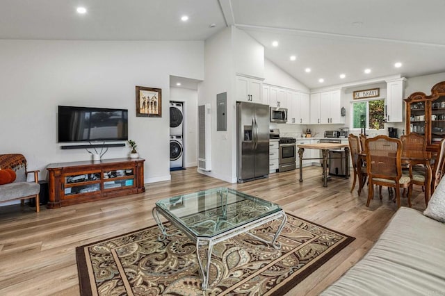 1254 13th St, Imperial Beach, CA 91932 - living area with stacked washer / dryer, electric panel, light wood finished floors, recessed lighting, and high vaulted ceiling