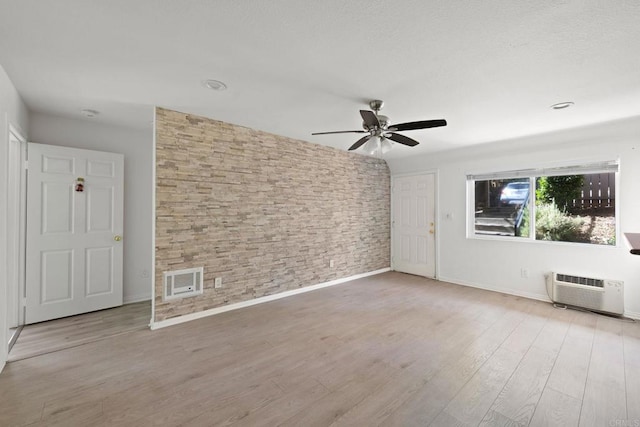 9860 Dale Ave Unit A8, Spring Valley, CA 91977 - unfurnished living room with a ceiling fan, wood finished floors, and an AC wall unit
