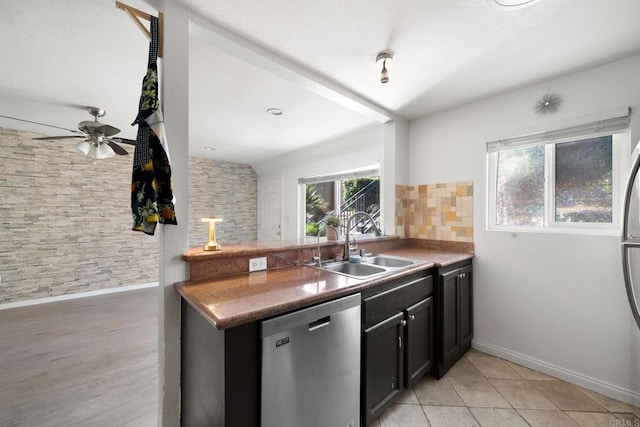 9860 Dale Ave Unit A8, Spring Valley, CA 91977 - kitchen with stainless steel dishwasher, backsplash, ceiling fan, dark cabinets, and a peninsula