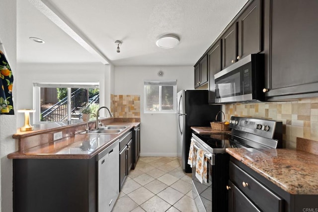 9860 Dale Ave Unit A8, Spring Valley, CA 91977 - kitchen featuring stainless steel appliances, tasteful backsplash, plenty of natural light, and light tile patterned floors