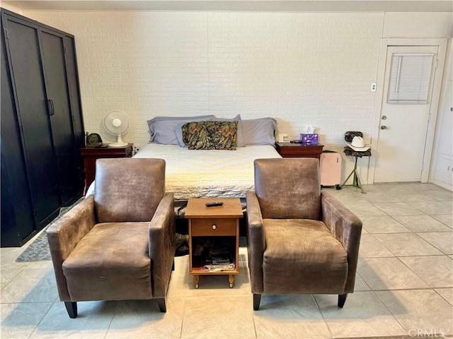 1602 W Dorothea Ave W, Visalia, CA 93277 - bedroom featuring light tile patterned flooring and brick wall