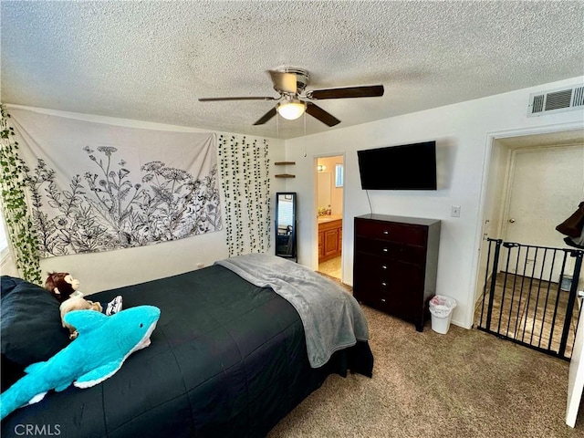1602 W Dorothea Ave W, Visalia, CA 93277 - carpeted bedroom featuring a textured ceiling, ceiling fan, and connected bathroom