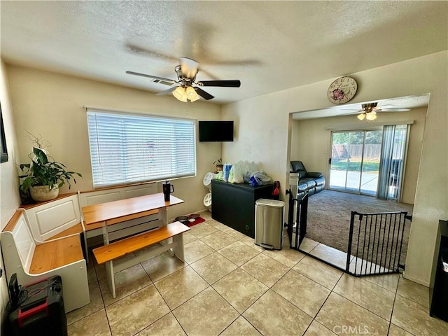 1602 W Dorothea Ave W, Visalia, CA 93277 - dining room featuring a ceiling fan, a textured ceiling, and light tile patterned flooring