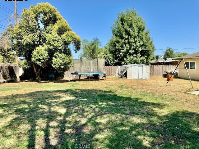 1602 W Dorothea Ave W, Visalia, CA 93277 - fenced backyard with a shed and a trampoline