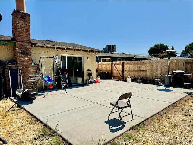 1602 W Dorothea Ave W, Visalia, CA 93277 - rear view of property with stucco siding, a patio area, and a shingled roof
