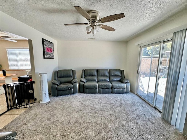 1602 W Dorothea Ave W, Visalia, CA 93277 - living area featuring a ceiling fan, carpet flooring, and a textured ceiling