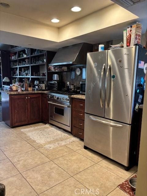 29441 Via La Plz, Murrieta, CA 92563 - kitchen featuring appliances with stainless steel finishes, wall chimney exhaust hood, light tile patterned floors, dark brown cabinets, and open shelves