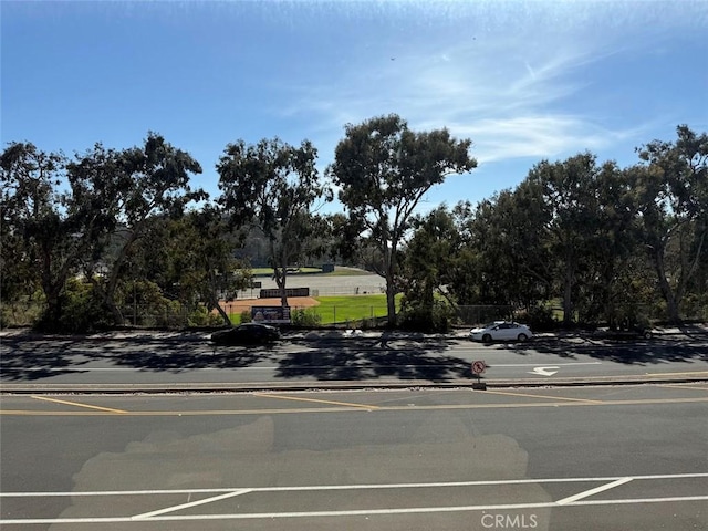 6812 Hyde Park Dr Unit C, San Diego, CA 92119 - view of asphalt road with curbs and view of wooded area
