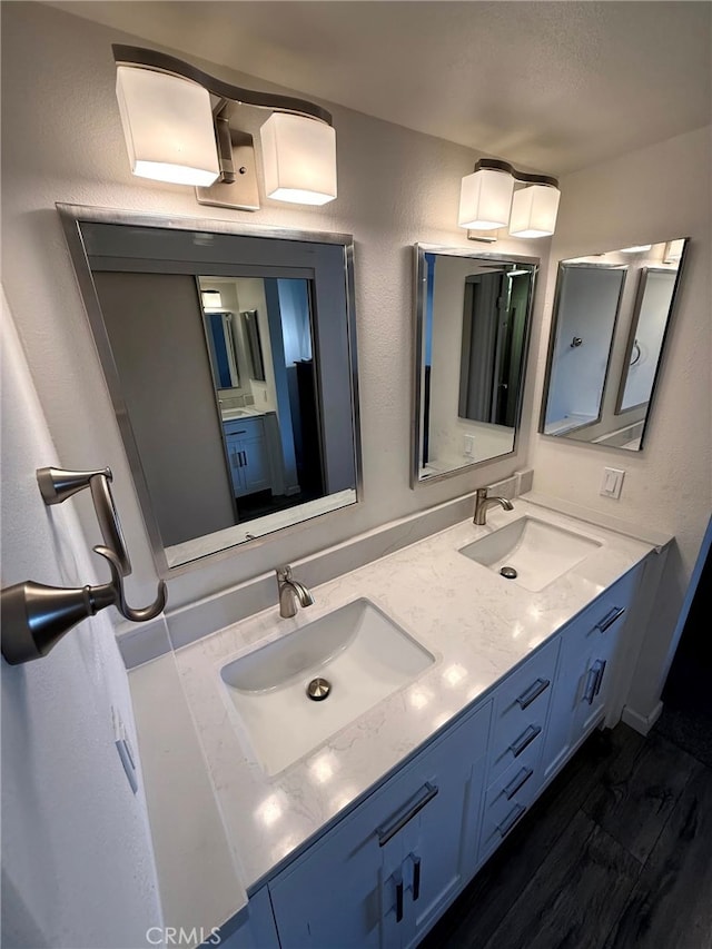 6812 Hyde Park Dr Unit C, San Diego, CA 92119 - full bath featuring double vanity and wood finished floors