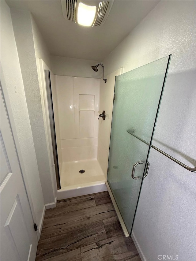 6812 Hyde Park Dr Unit C, San Diego, CA 92119 - bathroom with a shower stall and wood finished floors