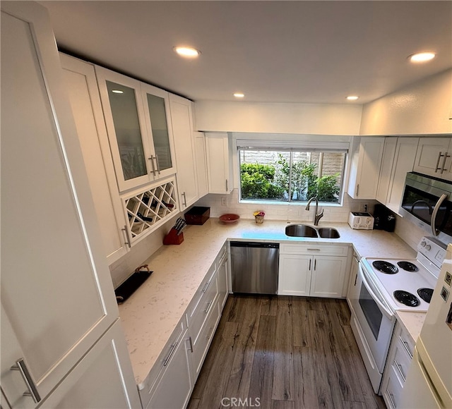 6812 Hyde Park Dr Unit C, San Diego, CA 92119 - kitchen with appliances with stainless steel finishes, decorative backsplash, glass insert cabinets, white cabinetry, and dark wood-style flooring