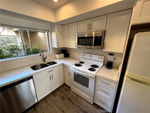 6812 Hyde Park Dr Unit C, San Diego, CA 92119 - kitchen with appliances with stainless steel finishes, decorative backsplash, dark wood-style flooring, white cabinets, and light stone countertops