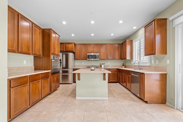 1789 Perrin Pl, Chula Vista, CA 91913 - kitchen with stainless steel appliances, recessed lighting, brown cabinets, a kitchen island, and light tile patterned flooring