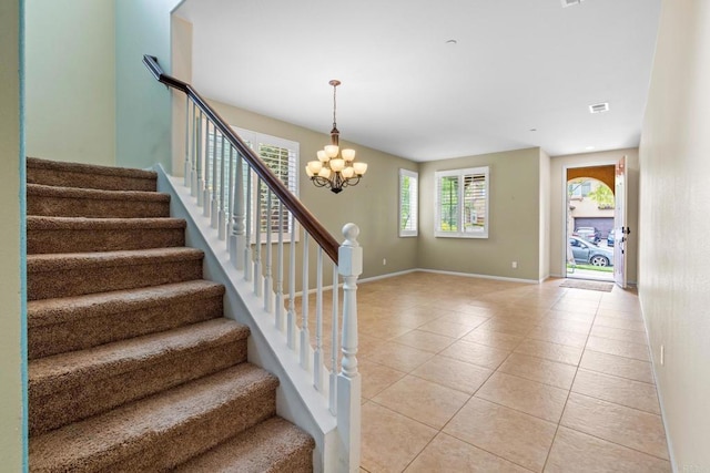 1789 Perrin Pl, Chula Vista, CA 91913 - staircase featuring tile patterned flooring and a chandelier