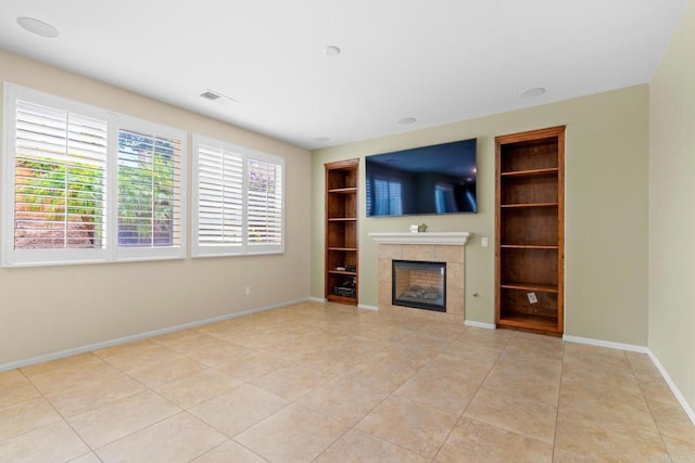 1789 Perrin Pl, Chula Vista, CA 91913 - unfurnished living room with built in features, a fireplace, and light tile patterned flooring