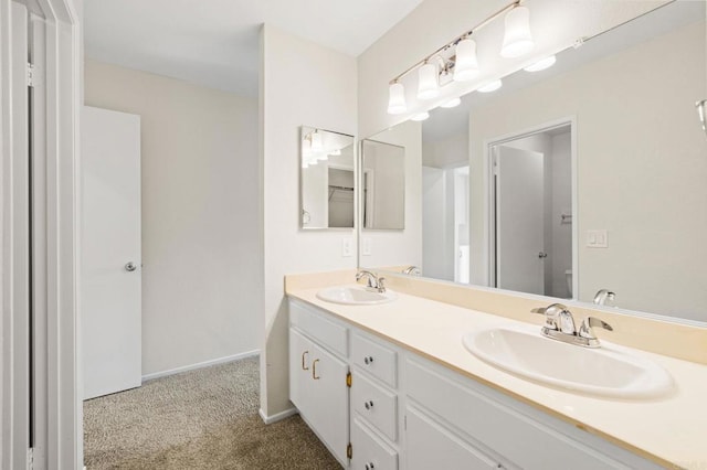 5149 Maplewood Cir, Oceanside, CA 92056 - bathroom with double vanity and baseboards
