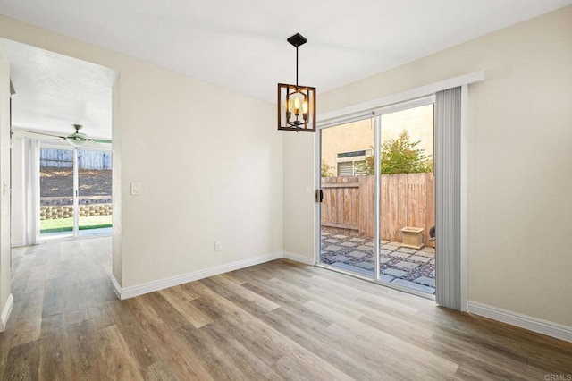 5149 Maplewood Cir, Oceanside, CA 92056 - unfurnished dining area featuring plenty of natural light, wood finished floors, a chandelier, and ceiling fan