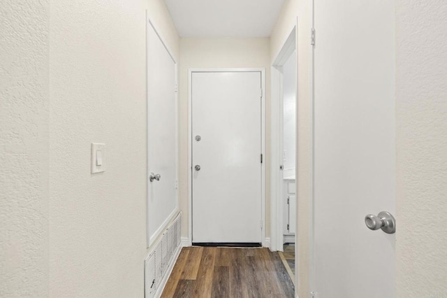 5149 Maplewood Cir, Oceanside, CA 92056 - corridor with wood finished floors and a textured wall