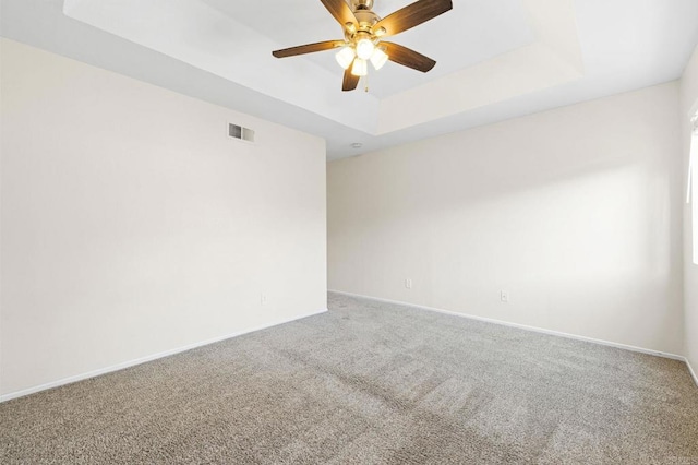5149 Maplewood Cir, Oceanside, CA 92056 - spare room with a tray ceiling, carpet floors, and ceiling fan