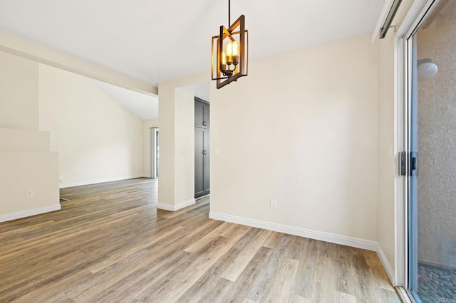 5149 Maplewood Cir, Oceanside, CA 92056 - empty room featuring light wood-type flooring and vaulted ceiling