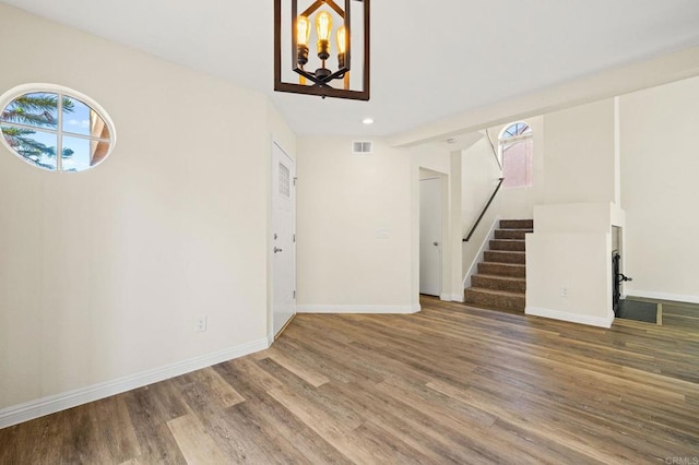 5149 Maplewood Cir, Oceanside, CA 92056 - unfurnished living room featuring stairs, wood finished floors, a chandelier, and recessed lighting