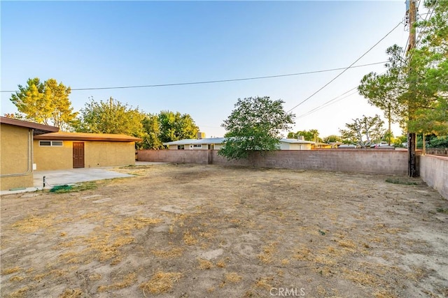2017 W Newgrove St, Lancaster, CA 93536 - fenced backyard with a patio area