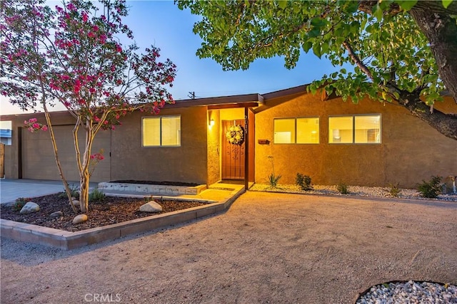 2017 W Newgrove St, Lancaster, CA 93536 - ranch-style home featuring stucco siding, concrete driveway, and an attached garage