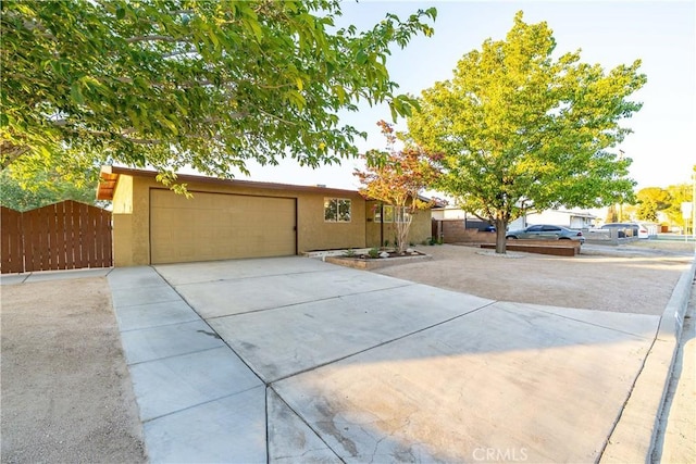 2017 W Newgrove St, Lancaster, CA 93536 - single story home featuring driveway, stucco siding, a garage, and a gate
