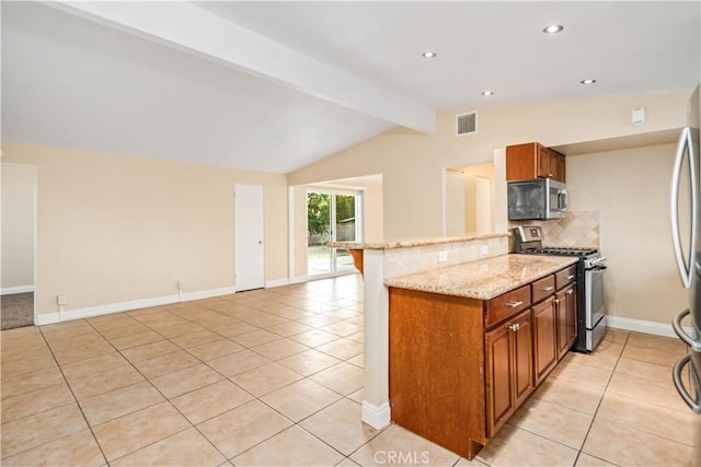 2017 W Newgrove St, Lancaster, CA 93536 - kitchen with appliances with stainless steel finishes, light tile patterned floors, tasteful backsplash, light stone countertops, and brown cabinets