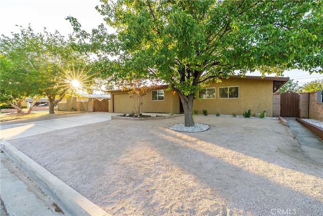 2017 W Newgrove St, Lancaster, CA 93536 - view of front of home featuring a gate, stucco siding, and driveway