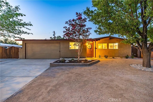 2017 W Newgrove St, Lancaster, CA 93536 - ranch-style house featuring an attached garage, driveway, and stucco siding