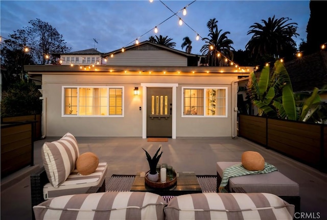 1030 Echo Park Ave, Los Angeles, CA 90026 - rear view of property featuring outdoor lounge area, a patio area, and stucco siding