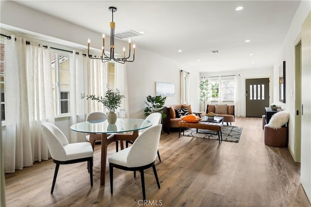 1030 Echo Park Ave, Los Angeles, CA 90026 - dining space featuring wood finished floors, a chandelier, and recessed lighting