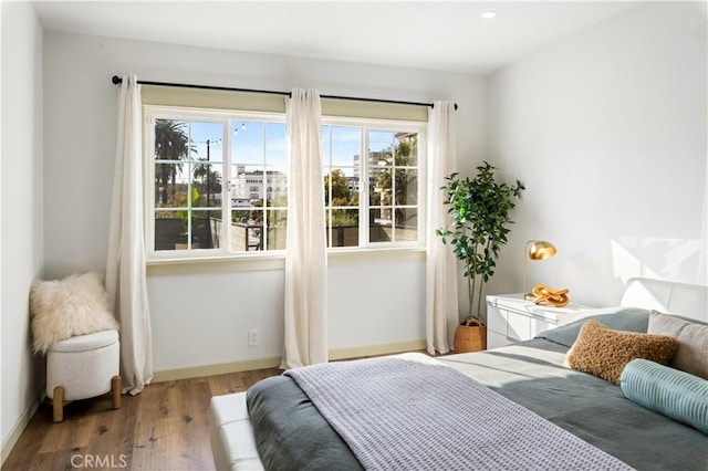 1030 Echo Park Ave, Los Angeles, CA 90026 - bedroom featuring multiple windows and wood finished floors