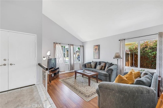 1358 Oakhurst Ct, Camarillo, CA 93010 - living area featuring healthy amount of natural light, high vaulted ceiling, and light wood-style flooring